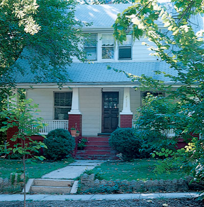 Sheltering trees and an old-fashioned porch contribute to natural cooling.